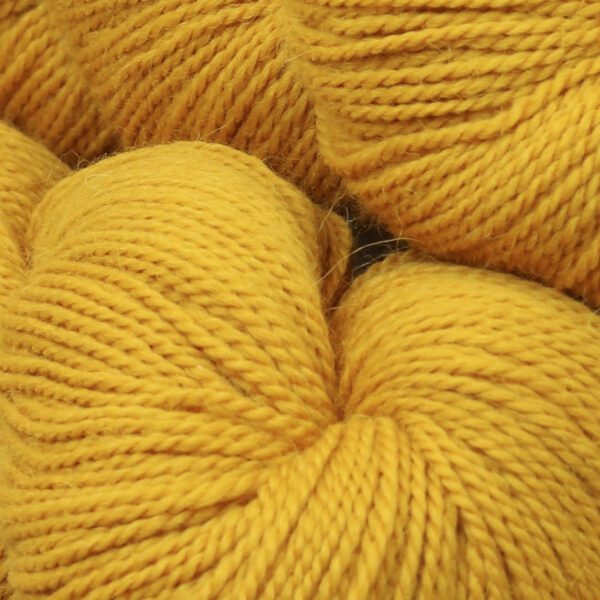 Close up image of soft wool in yellow color