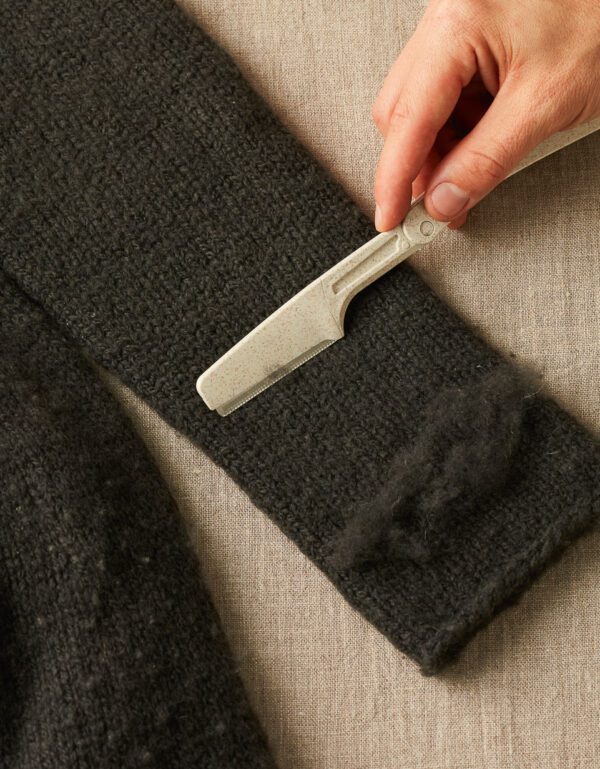 A fabric shaver on a woolen cloth
