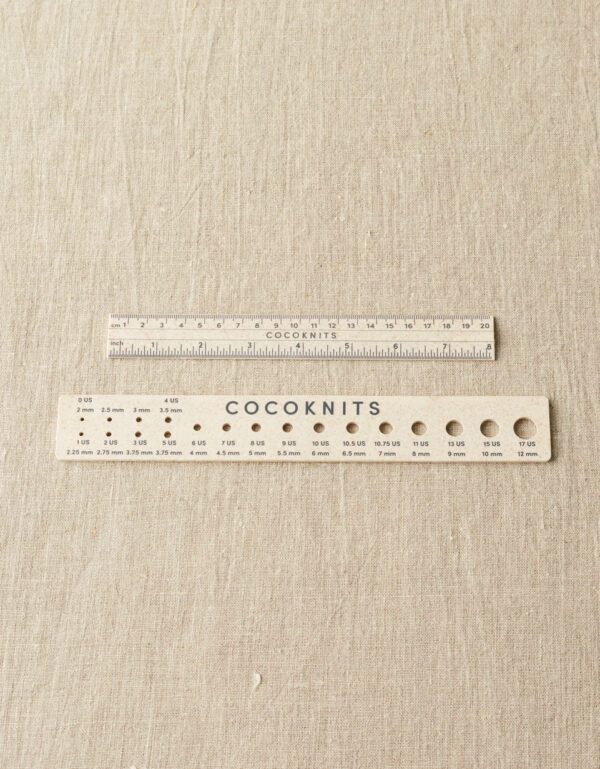 Two different size rulers on a cloth sheet